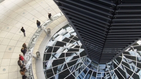 Double Duty: The cowl within the Bundestag's glass dome provides both natural ventilation and lighting to the assembly hall below