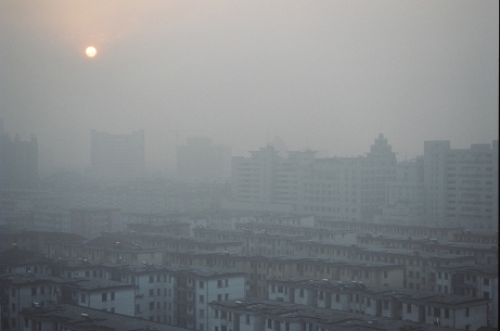 Smothered: A rising sun struggles to pierce the sooty air that hangs over Jinhua, a city of 1 million residents southwest of Shanghai